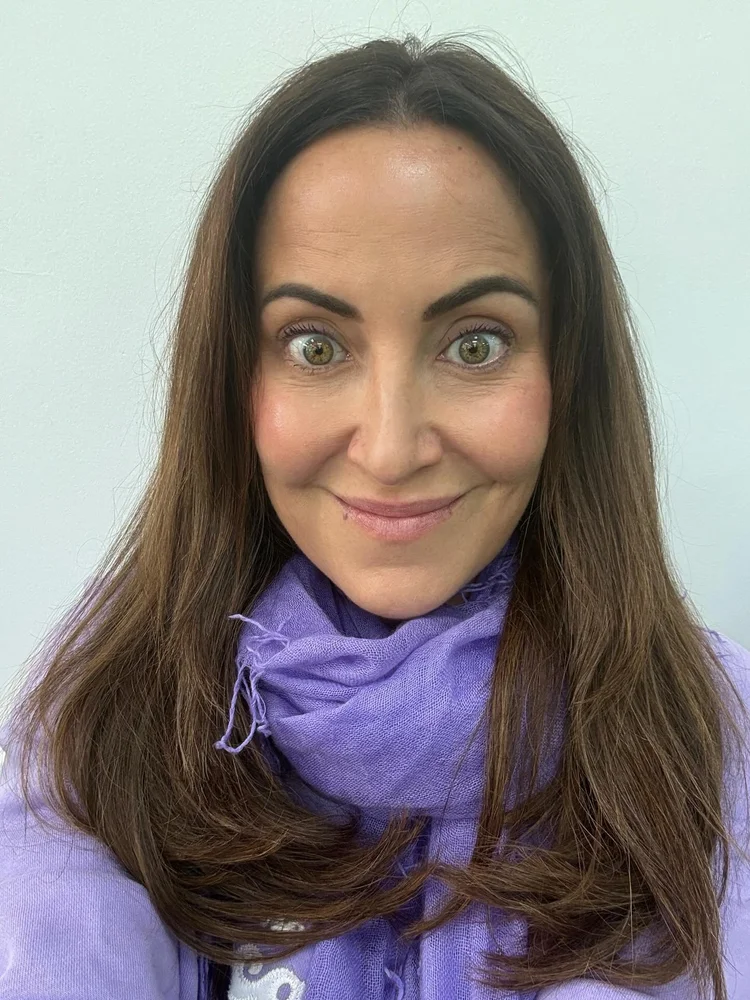Kate wearing a lilac scarf — one of her power colors